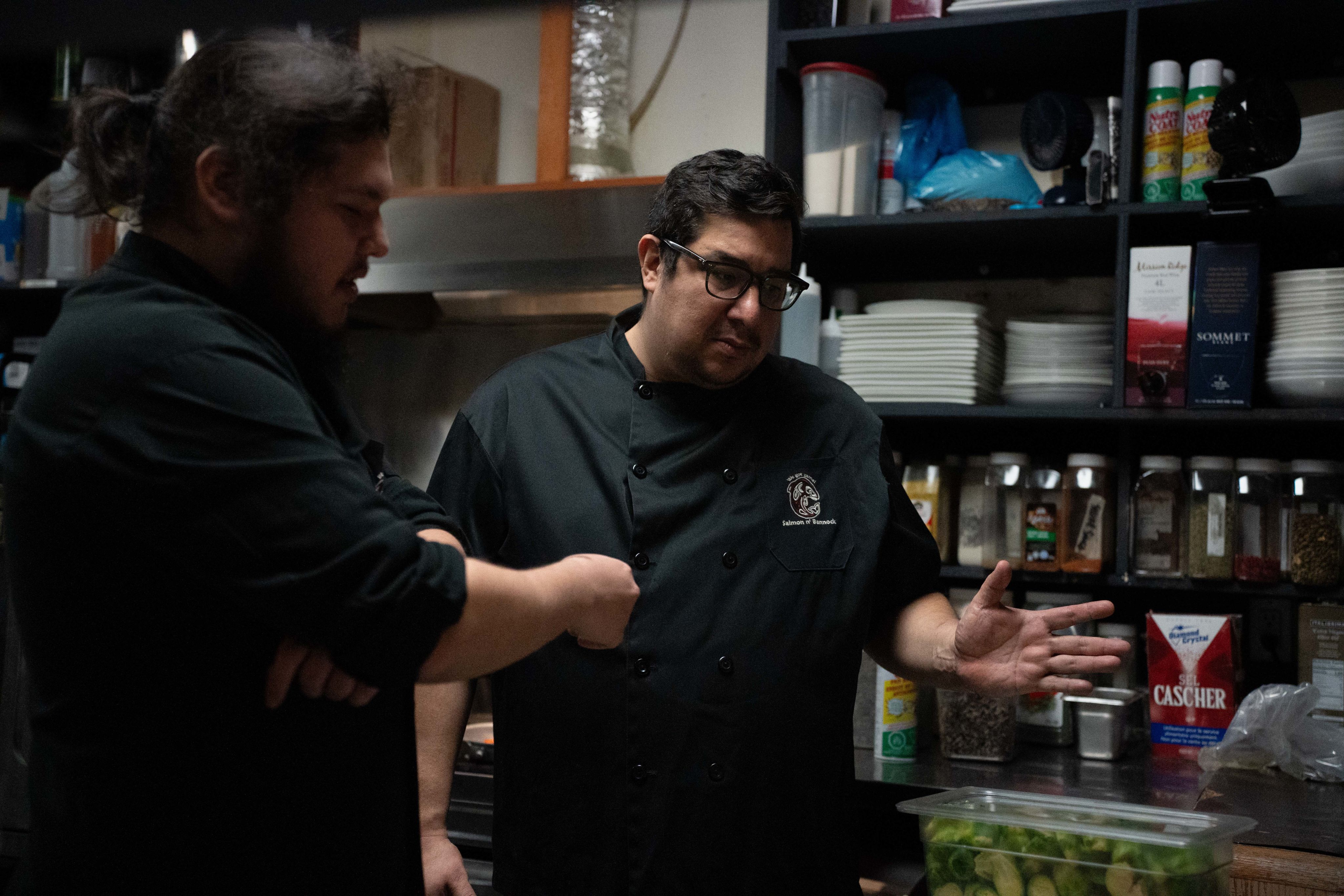 Chef Ryan Cartier (left) and kitchen manager & chef Paul Fortin (right) in the kitchen at Salmon n' Bannock
