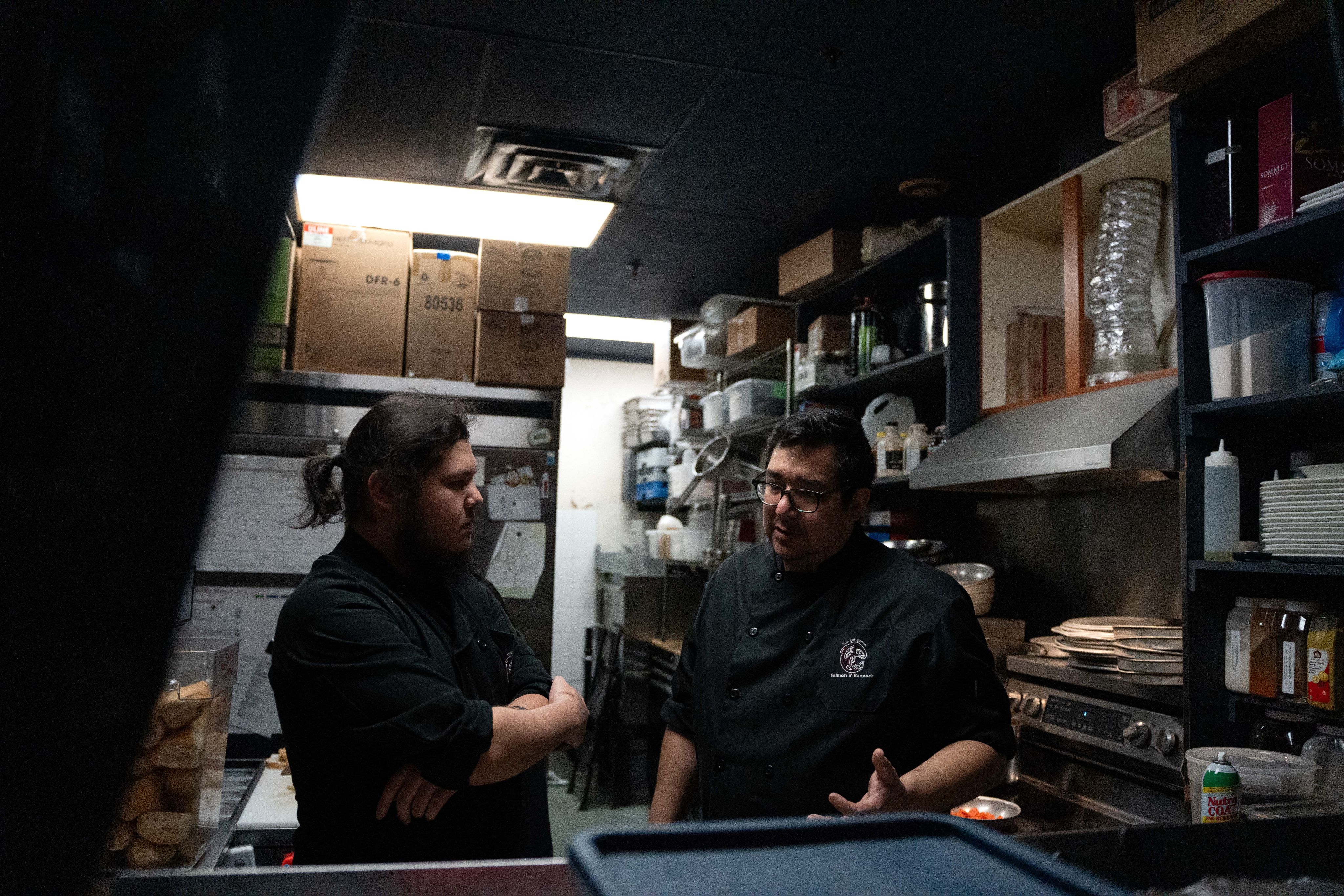Chef Ryan Cartier (left) and kitchen manager & chef Paul Fortin (right) in the kitchen at Salmon n' Bannock